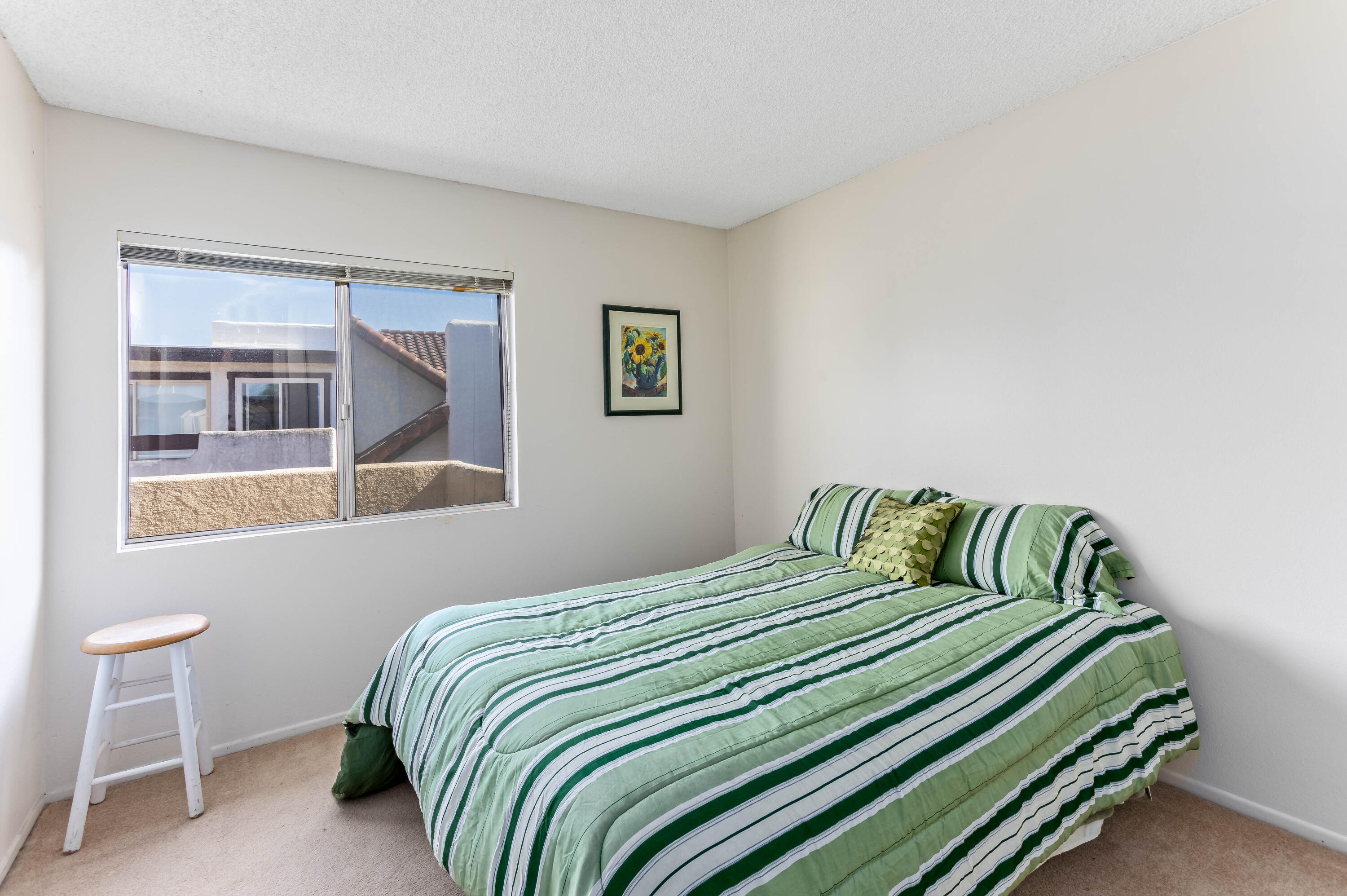 4742 Camino Del Rey Santa Barbara, CA 93110 - Photo 12 of 19 a bedroom with a bed and a window