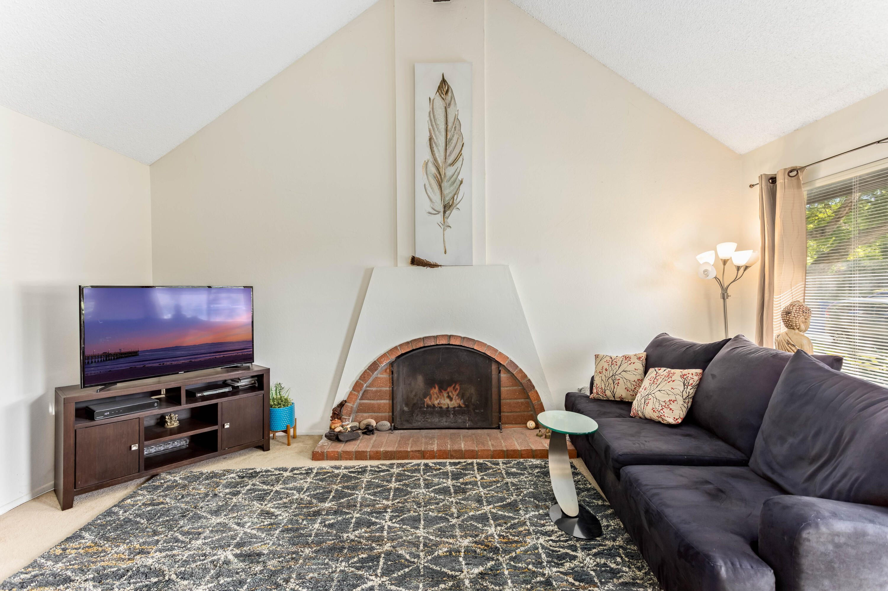 4742 Camino Del Rey Santa Barbara, CA 93110 - Photo 2 of 19 a living room with furniture a flat screen tv and a window