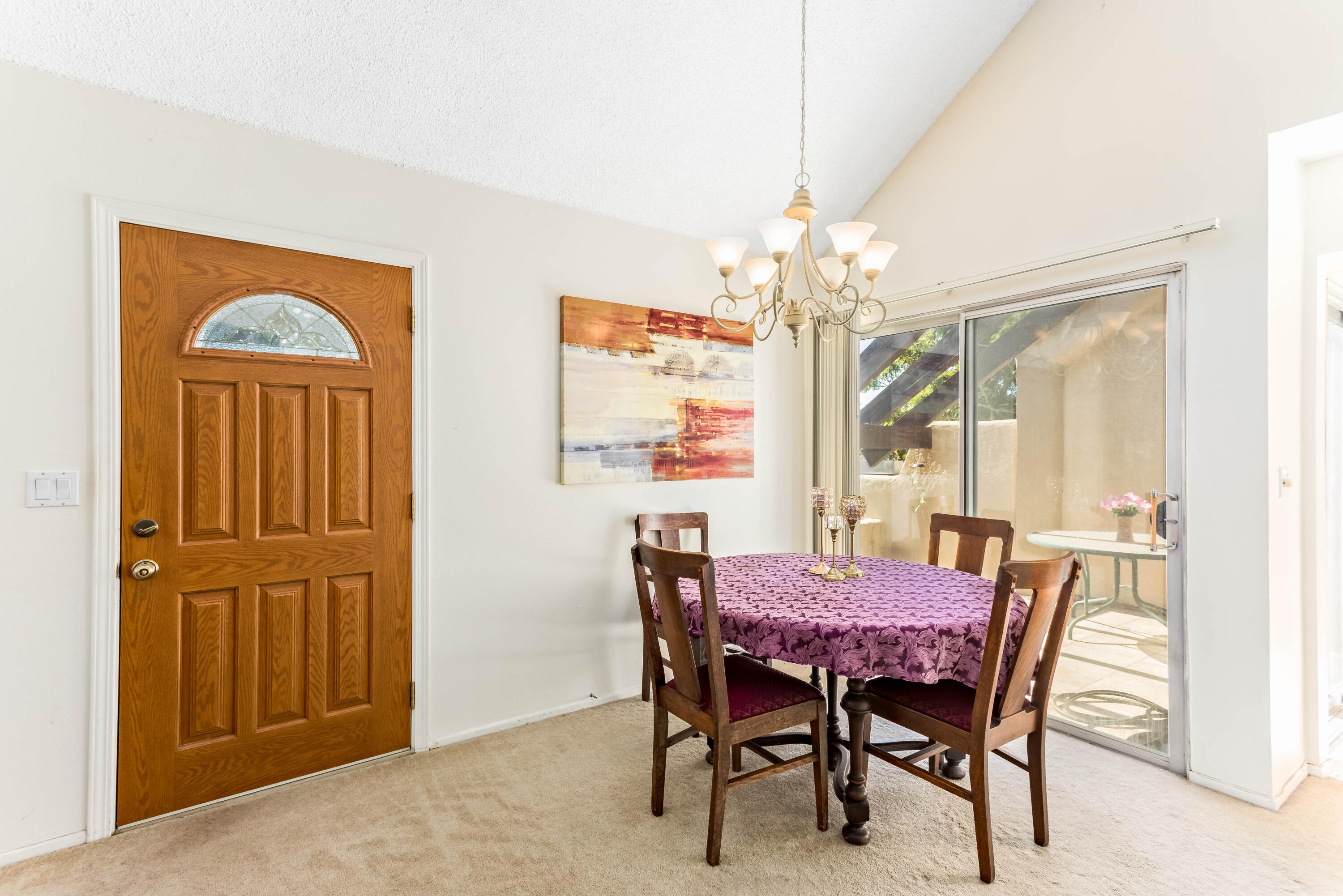 4742 Camino Del Rey Santa Barbara, CA 93110 - Photo 4 of 19 a dining room with furniture a chandelier and window