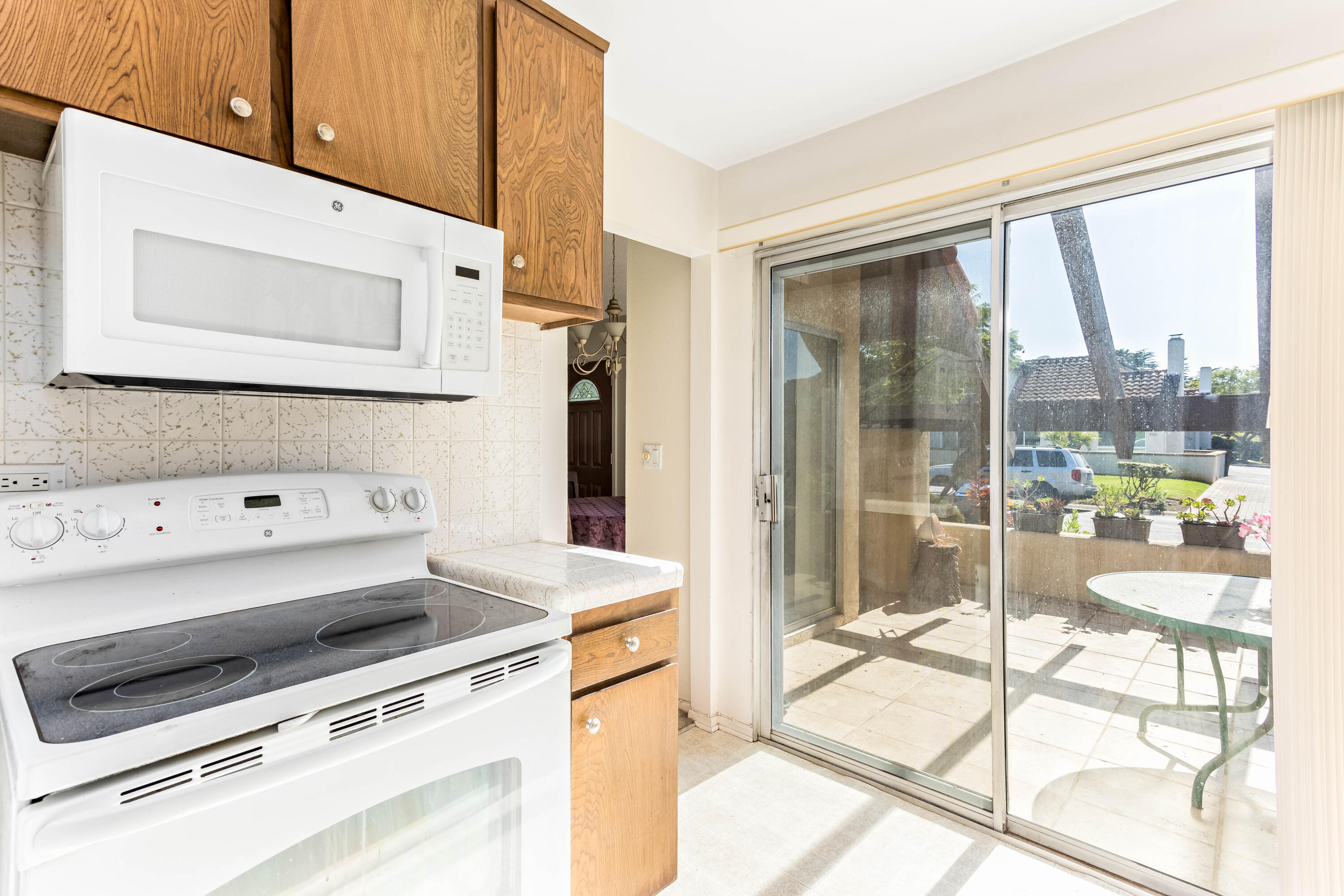 4742 Camino Del Rey Santa Barbara, CA 93110 - Photo 6 of 19 a kitchen with a stove a sink and a refrigerator