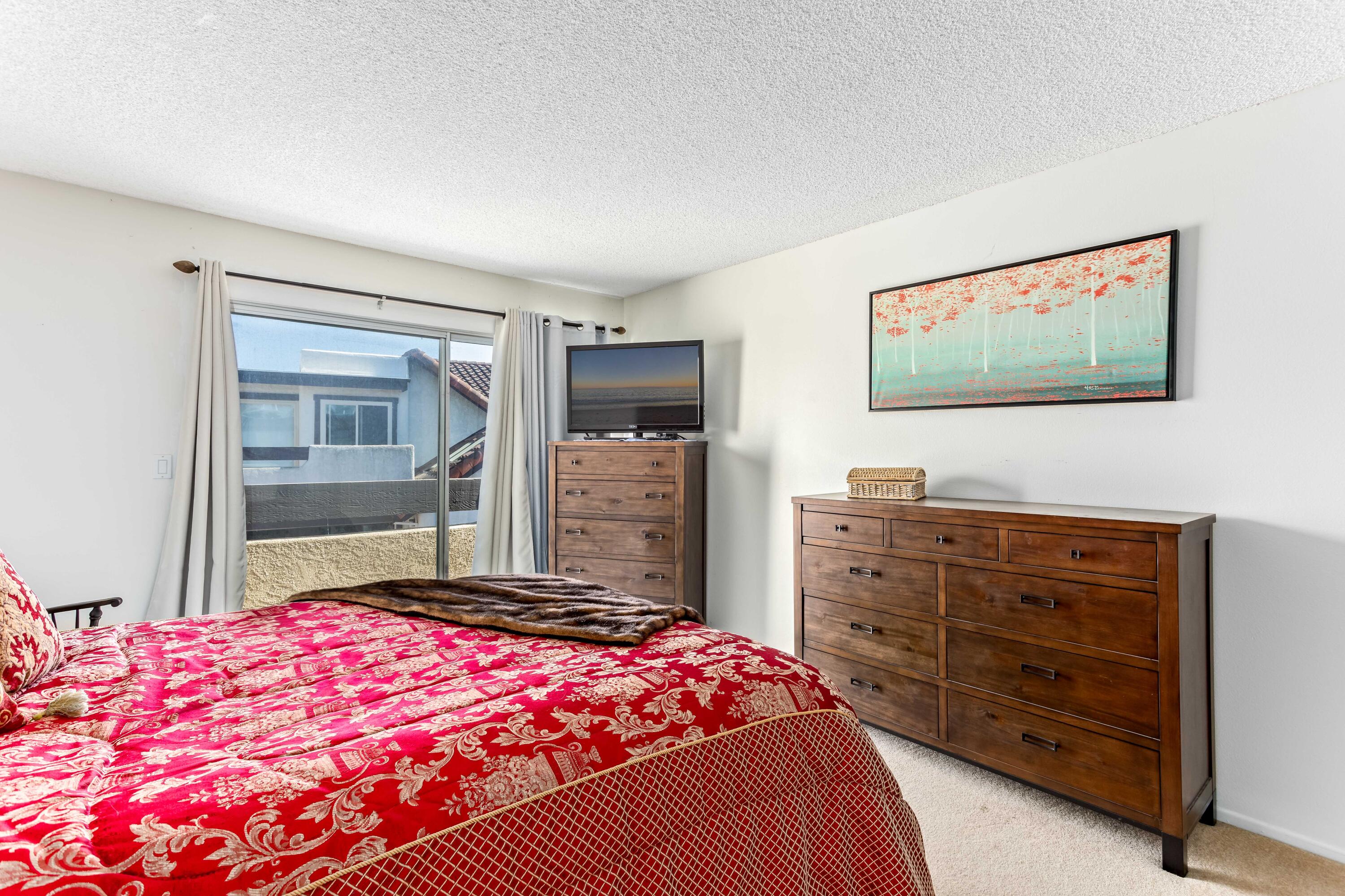 4742 Camino Del Rey Santa Barbara, CA 93110 - Photo 9 of 19 a bedroom with a bed and a flat screen tv