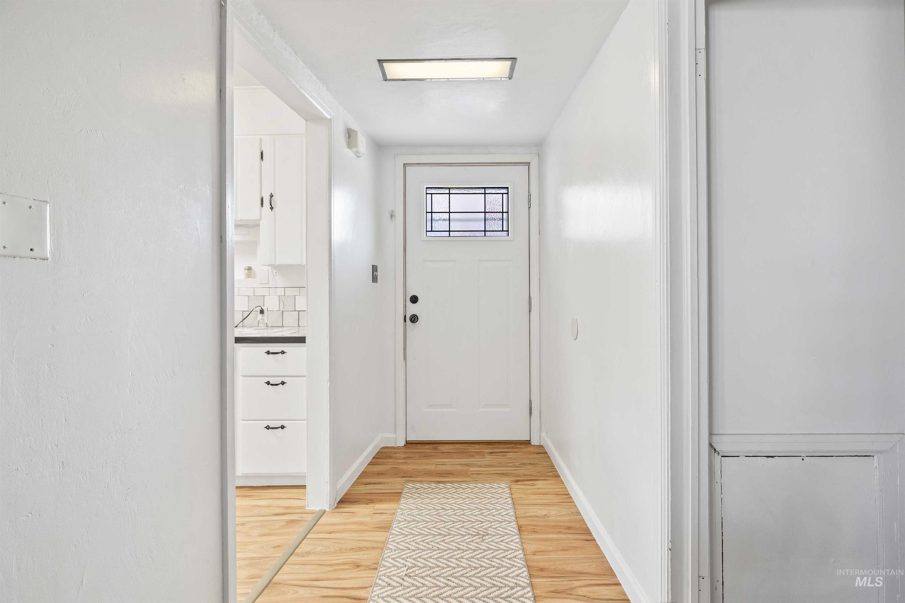 817 Union Avenue Filer, ID 83328 - Photo 2 of 37 Doorway to outside with wood finished floors and baseboards