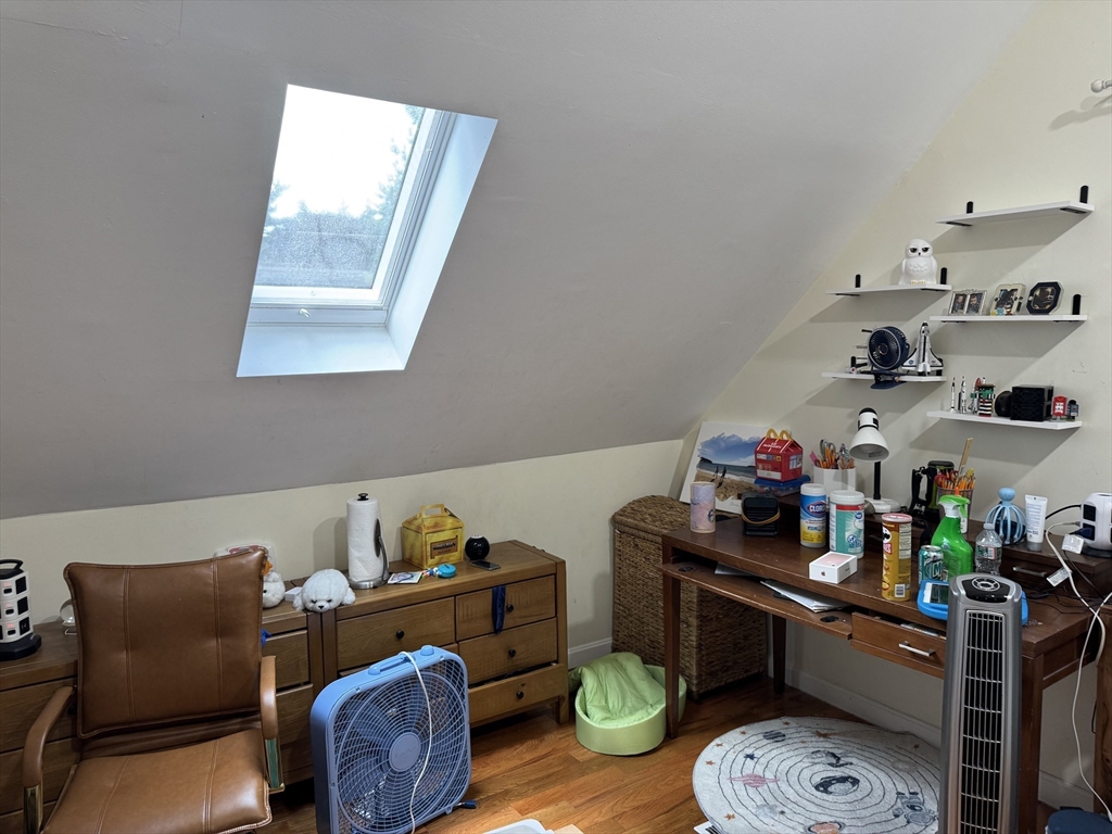 8 Heritage Road, Unit 1 Pelham, NH 03076 - Photo 7 of 13 a room with furniture toys and a dining table