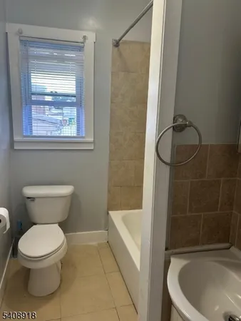 a bathroom with a toilet and shower