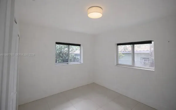 an empty room with windows
