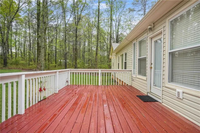 a view of deck with wooden floor and fence