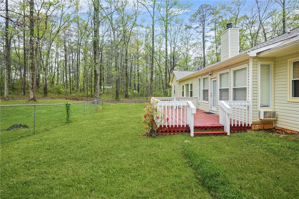 125 Bridget Drive Hampton, GA 30228 - Photo 24 of 32 a front view of a house with garden and trees