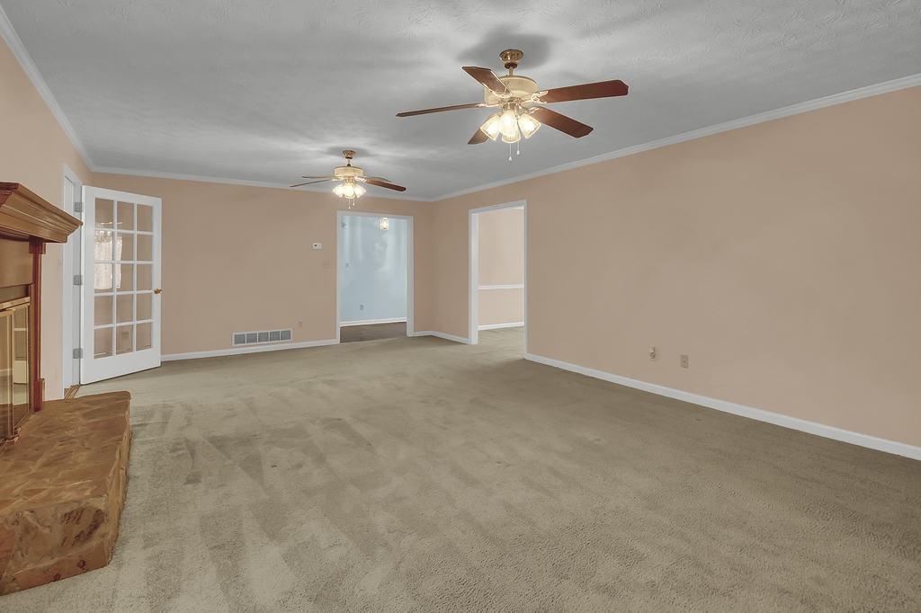 125 Bridget Drive Hampton, GA 30228 - Photo 6 of 32 a view of an empty room with chandelier fan