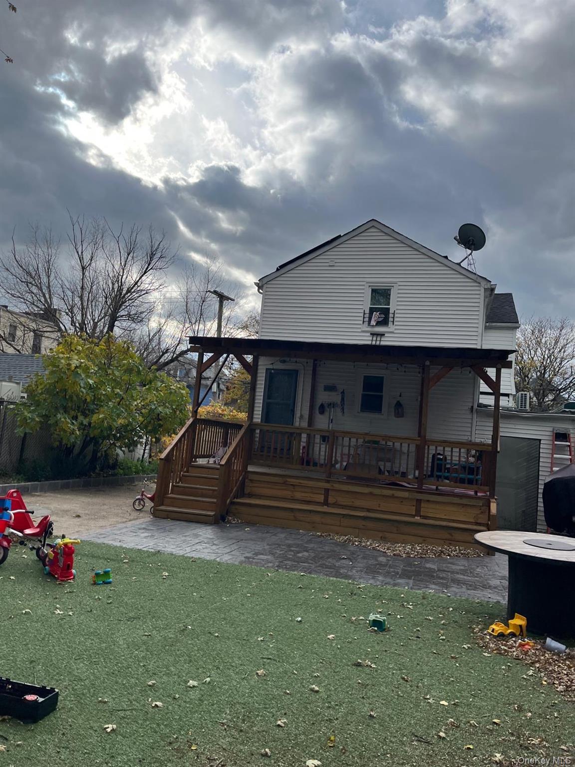 110-47 166th Street Queens, NY 11433 - Photo 2 of 2 a view of a house with backyard and sitting area