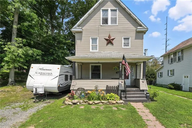 a front view of a house with a yard