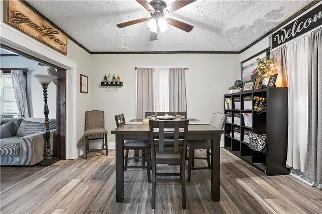 a view of a dining room with furniture and wooden floor