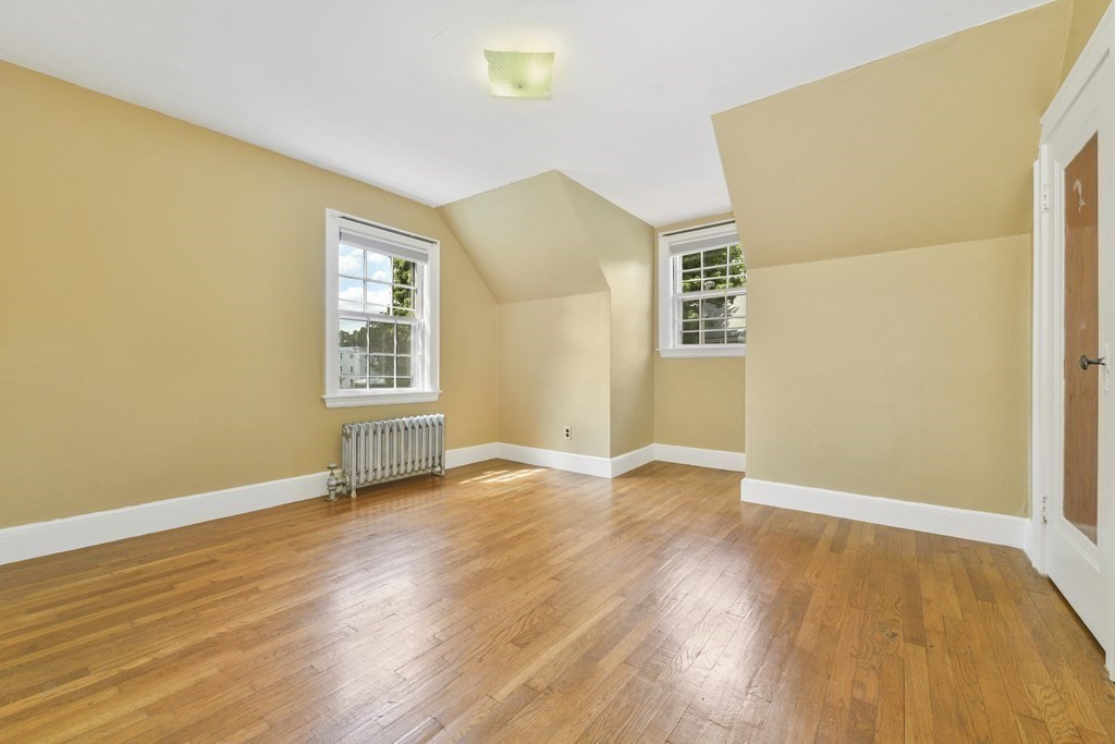 11 Southbourne Road Boston, MA 02130 - Photo 12 of 26 an empty room with wooden floor and windows