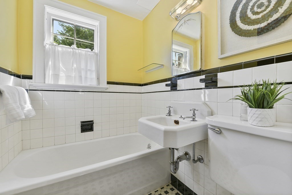 11 Southbourne Road Boston, MA 02130 - Photo 15 of 26 a bathroom with a sink a bathtub and a window