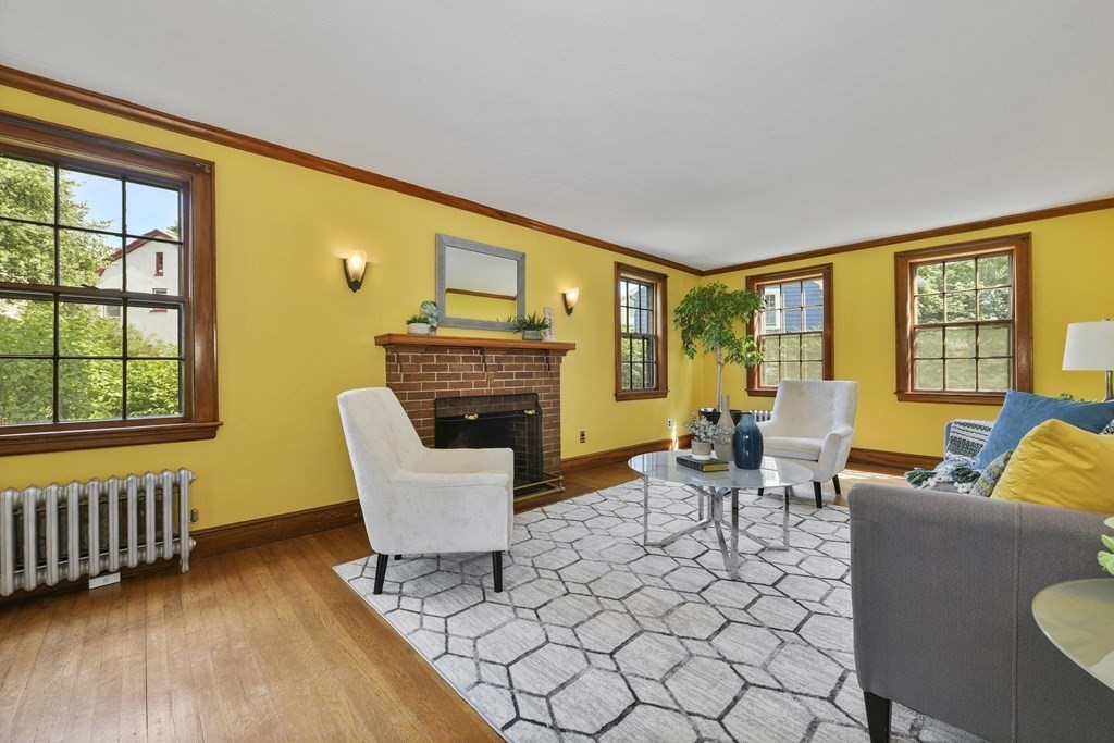 11 Southbourne Road Boston, MA 02130 - Photo 4 of 26 a living room with furniture a fireplace and a large window