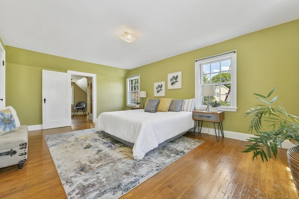 11 Southbourne Road Boston, MA 02130 - Photo 9 of 26 a bedroom with a bed and a table in it