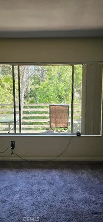 a view of a backyard with sitting area and furniture