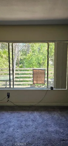 a view of a backyard with sitting area and furniture