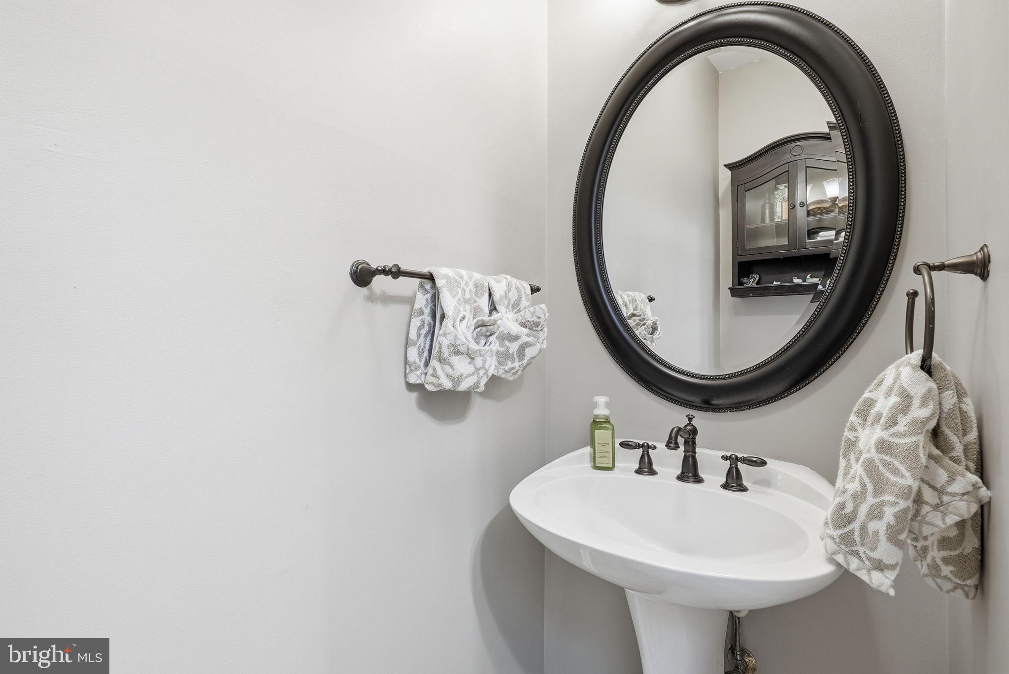 11411 Hollow Timber Court Reston, VA 20194 - Photo 20 of 46 a bathroom with a sink and a mirror