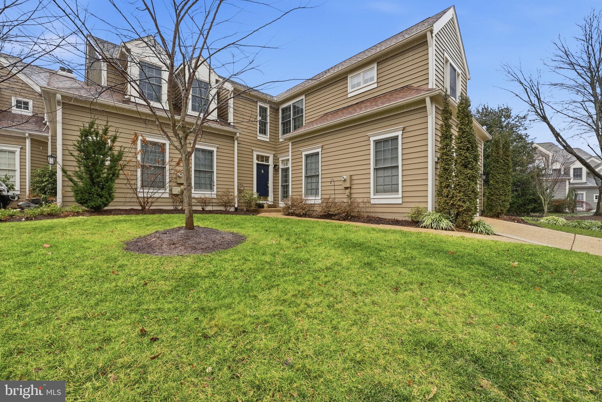 11411 Hollow Timber Court Reston, VA 20194 - Photo 2 of 46 a front view of a house with a yard and garage