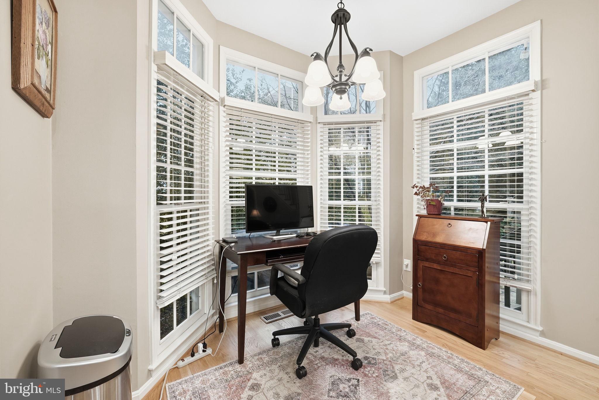 11411 Hollow Timber Court Reston, VA 20194 - Photo 21 of 46 a view of a workspace with furniture and a window
