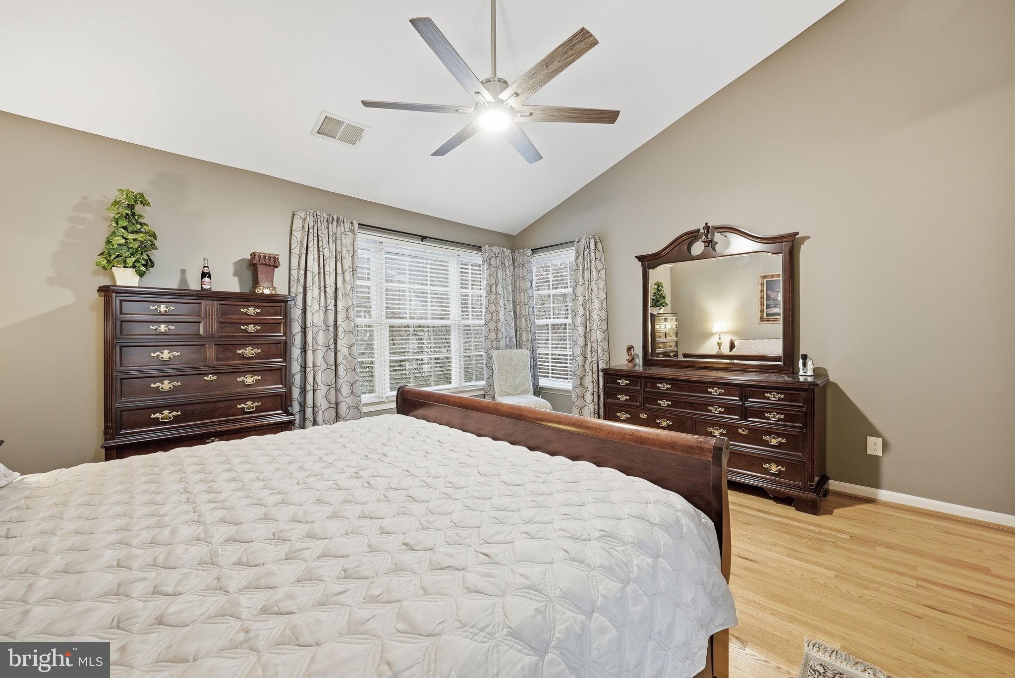 11411 Hollow Timber Court Reston, VA 20194 - Photo 26 of 46 a bedroom with a bed and a flat screen tv