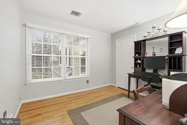 a workspace with furniture and window