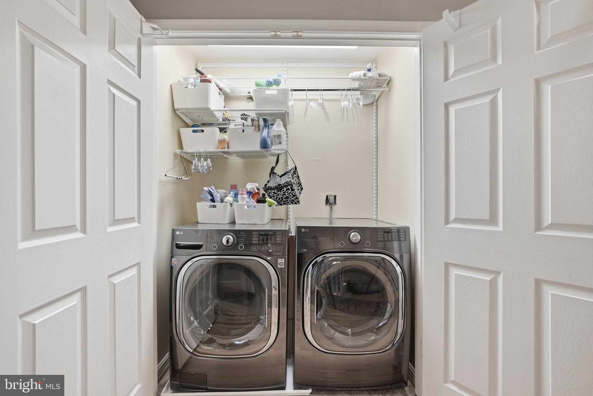 11411 Hollow Timber Court Reston, VA 20194 - Photo 30 of 46 a utility room with closet dryer and washer