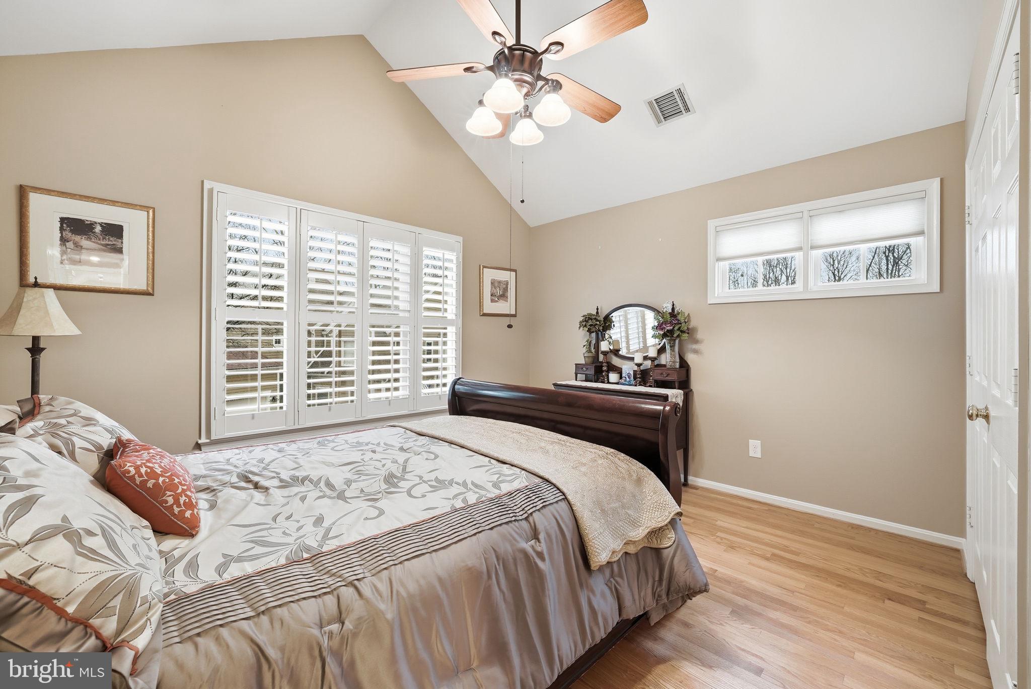 11411 Hollow Timber Court Reston, VA 20194 - Photo 32 of 46 a bedroom with a bed and a window