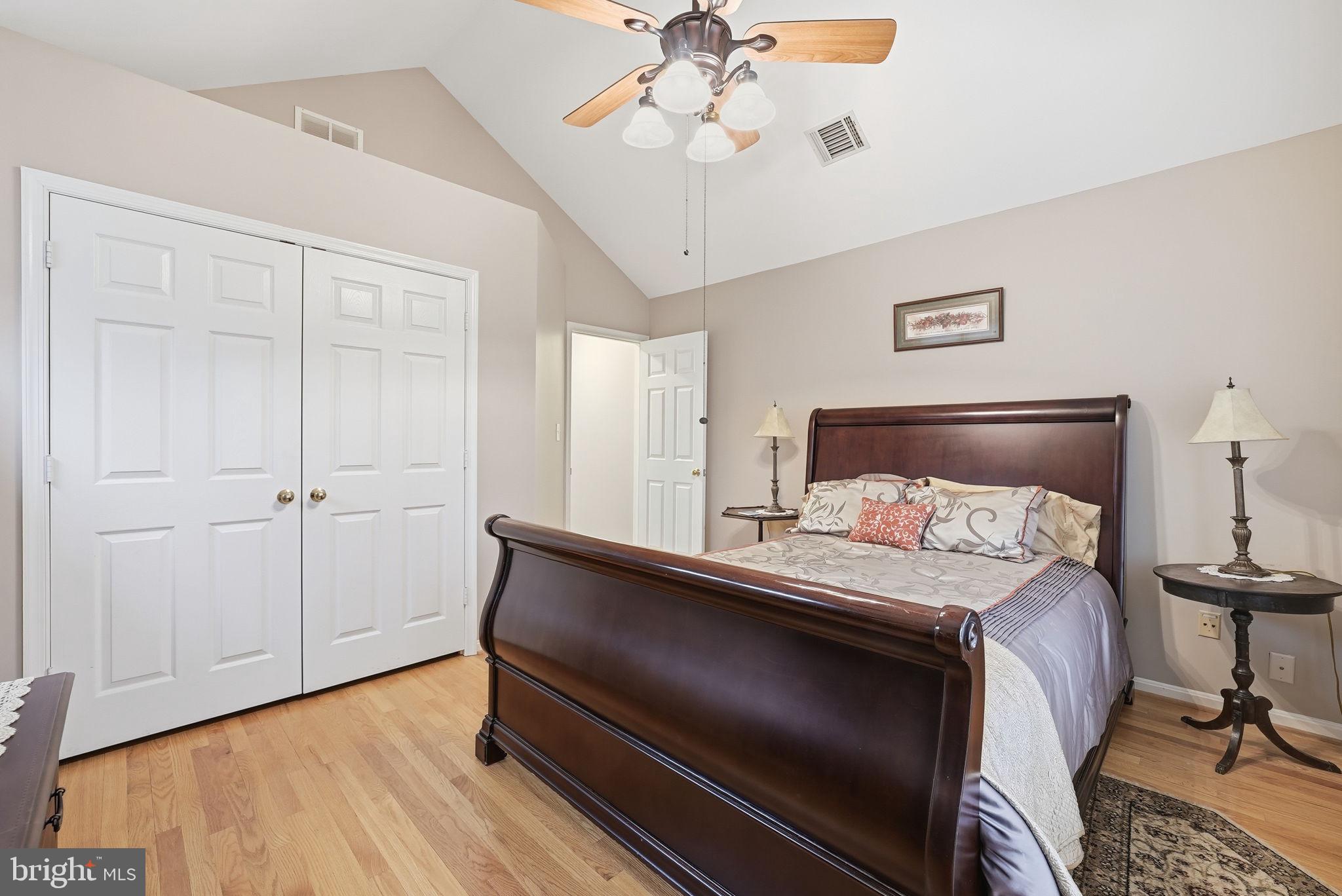 11411 Hollow Timber Court Reston, VA 20194 - Photo 33 of 46 a bedroom with a bed and a chandelier