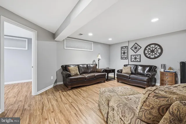 a living room with a couch and a window