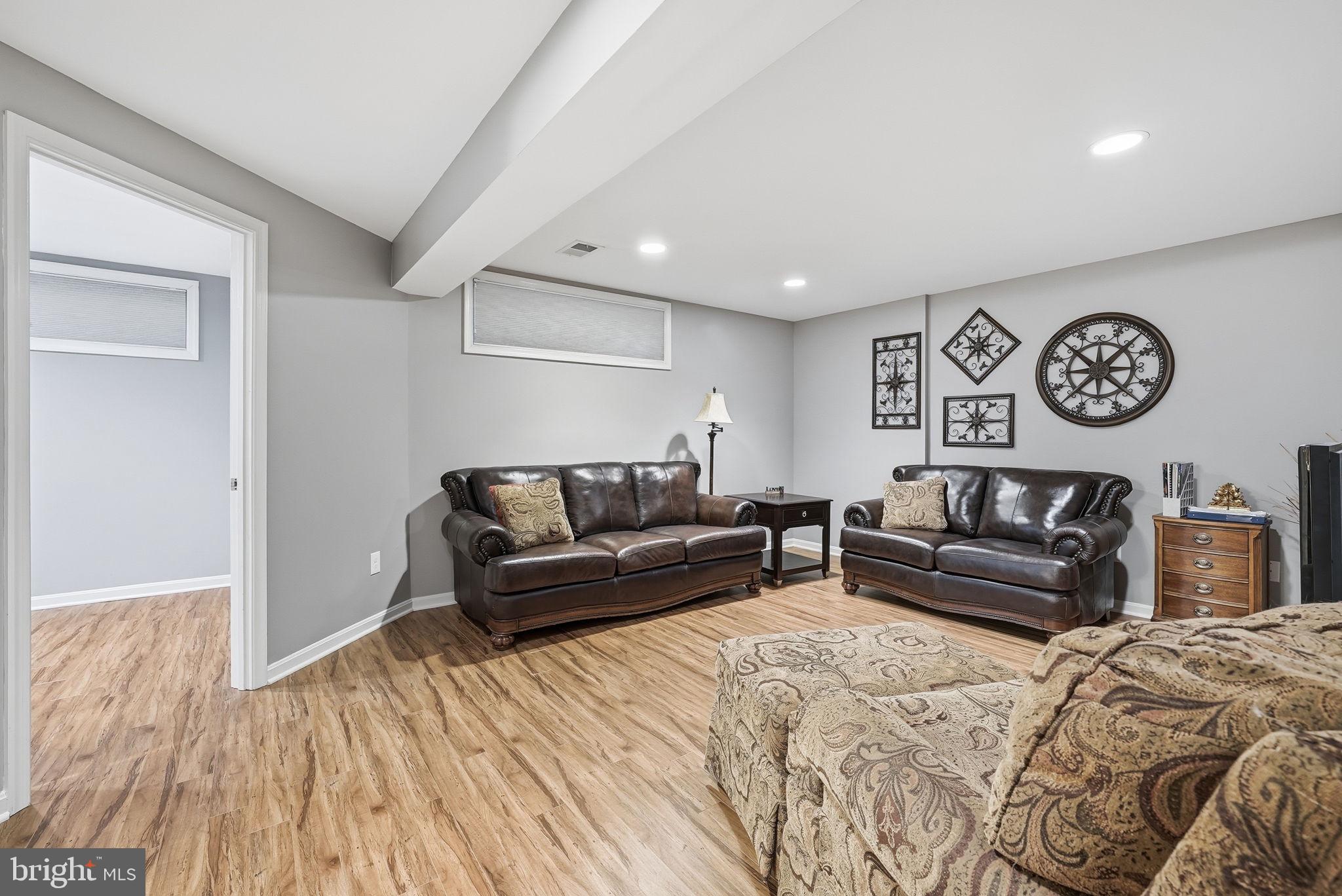 11411 Hollow Timber Court Reston, VA 20194 - Photo 36 of 46 a living room with a couch and a window