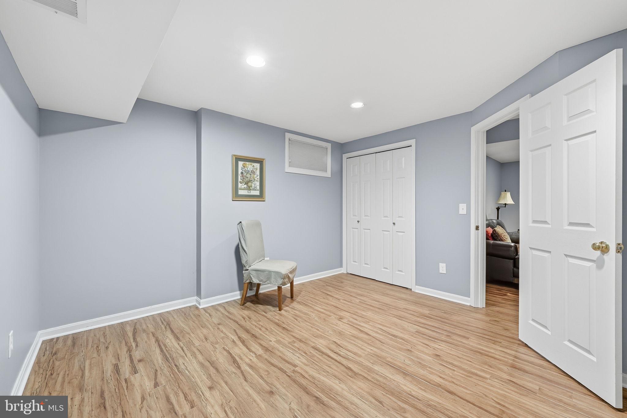11411 Hollow Timber Court Reston, VA 20194 - Photo 39 of 46 a view of a room with wooden floor and furniture