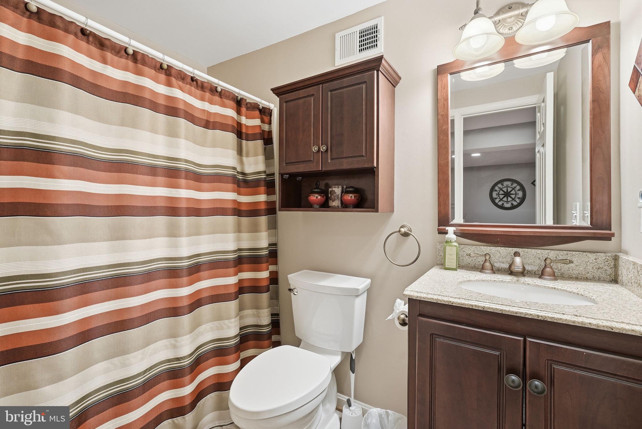 11411 Hollow Timber Court Reston, VA 20194 - Photo 40 of 46 a bathroom with a sink toilet and shower