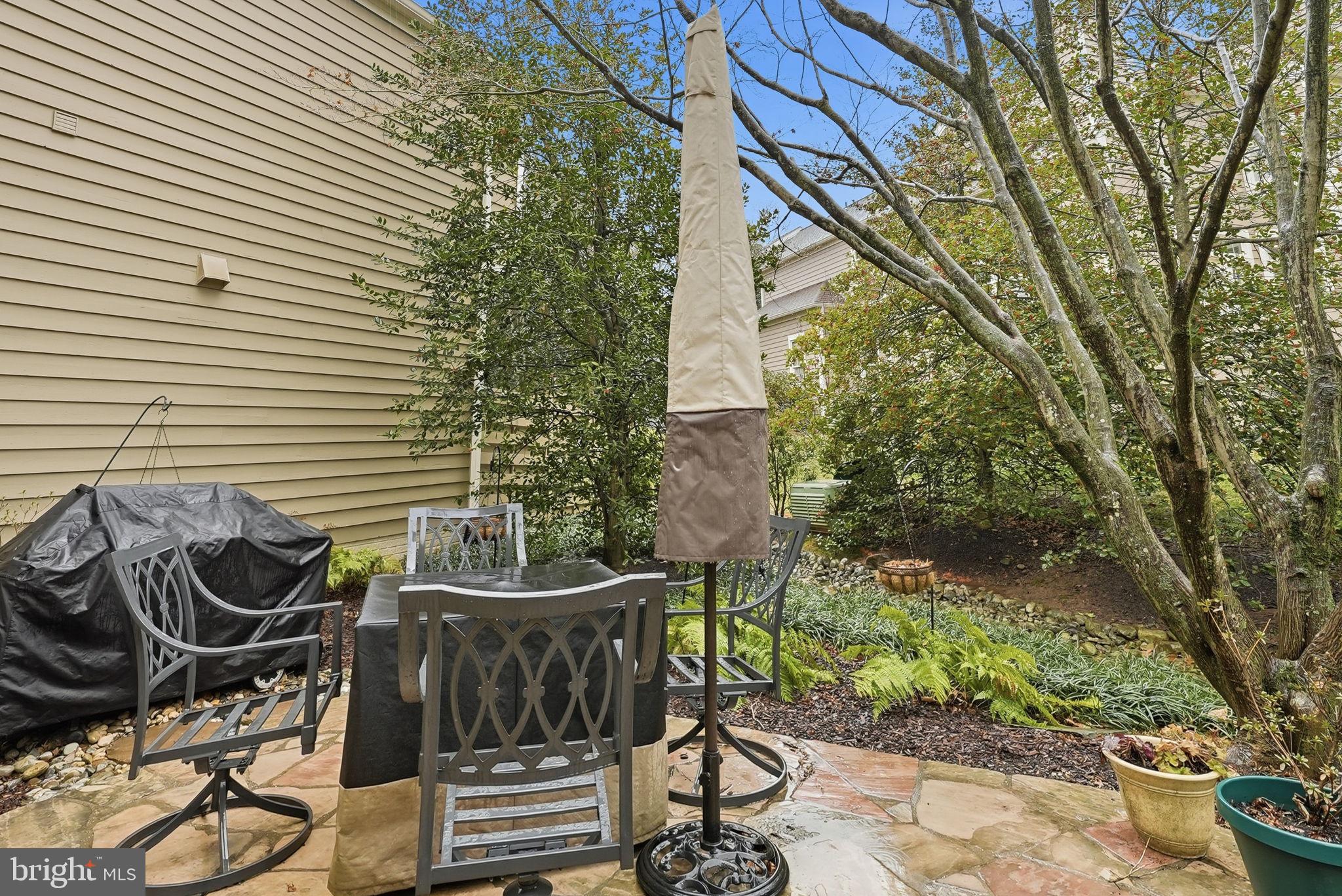 11411 Hollow Timber Court Reston, VA 20194 - Photo 41 of 46 a wooden bench sitting in front of a house