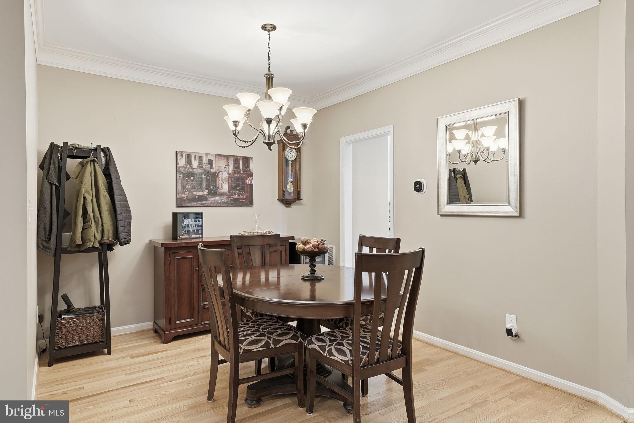 11411 Hollow Timber Court Reston, VA 20194 - Photo 10 of 46 a view of a dining room with furniture and wooden floor