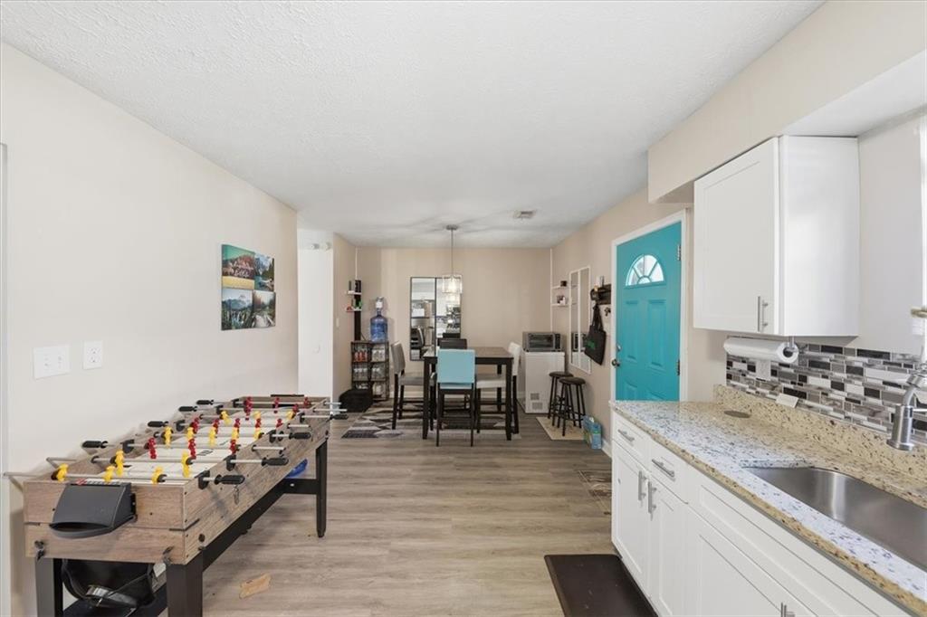 3682 Stephanie Court Powder Springs, GA 30127 - Photo 12 of 23 a living room with furniture and wooden floor