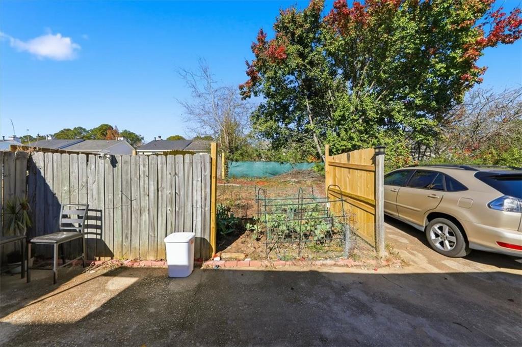 3682 Stephanie Court Powder Springs, GA 30127 - Photo 22 of 23 a view of a backyard with a car parked