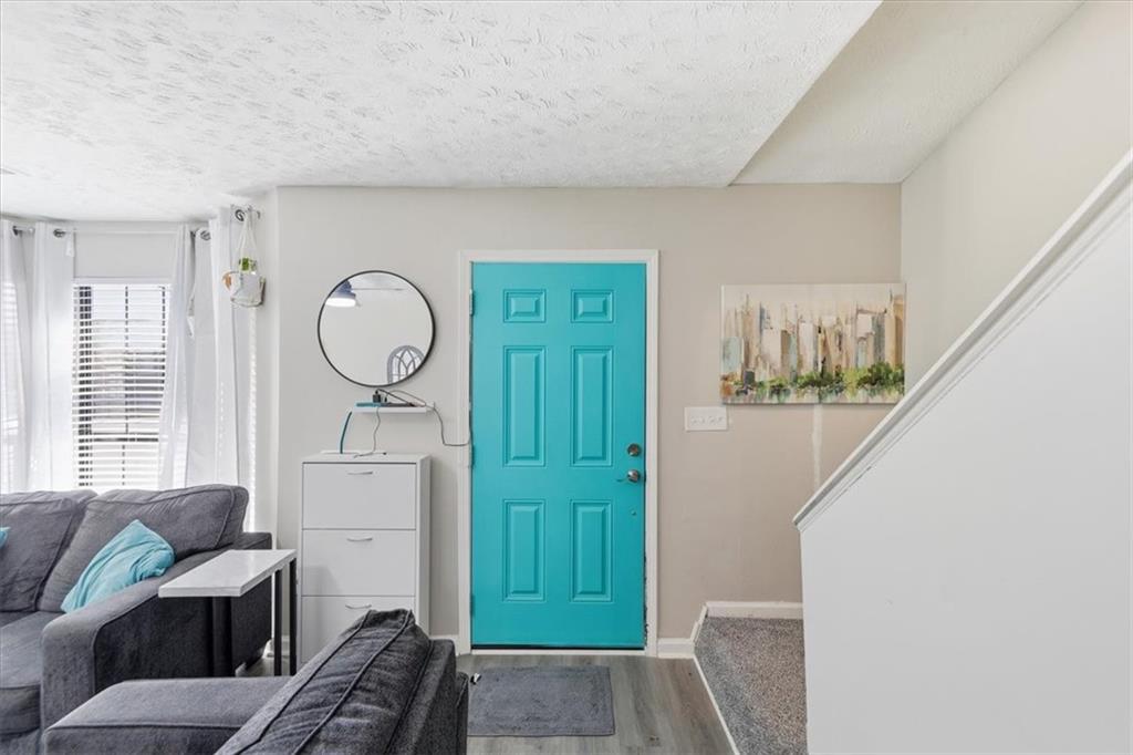 3682 Stephanie Court Powder Springs, GA 30127 - Photo 3 of 23 a living room with furniture and a mirror