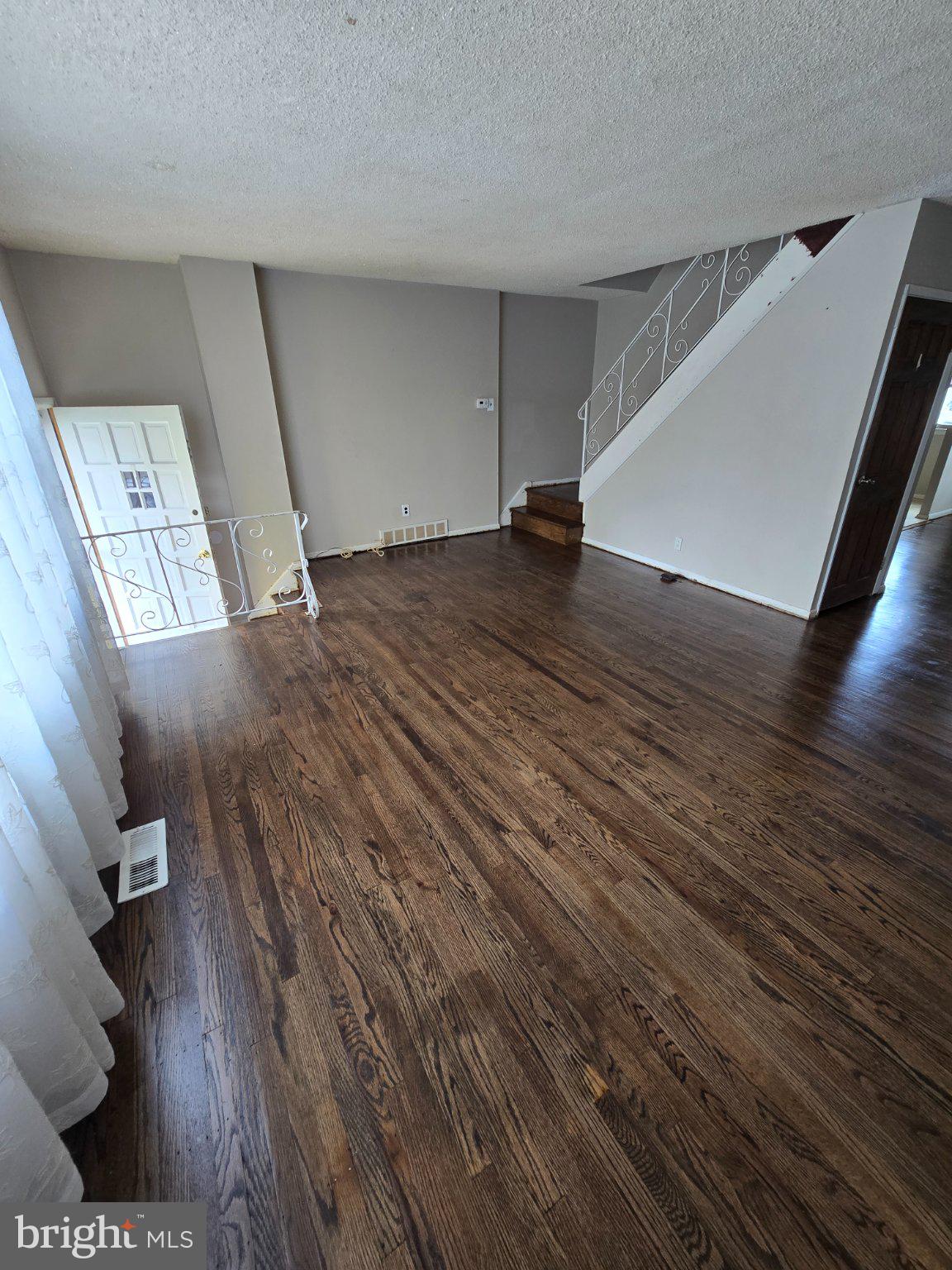 12729 Elnora Road Philadelphia, PA 19154 - Photo 3 of 19 Spacious living area with elegant stairs.