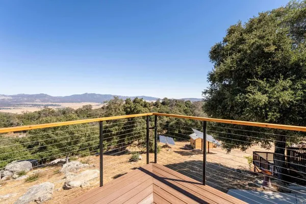 a view of mountain with wooden floor