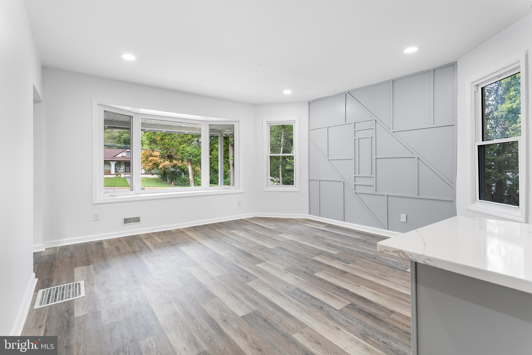 97 Erial Road Clementon, NJ 08021 - Photo 11 of 48 a view of an empty room with a window and wooden floor