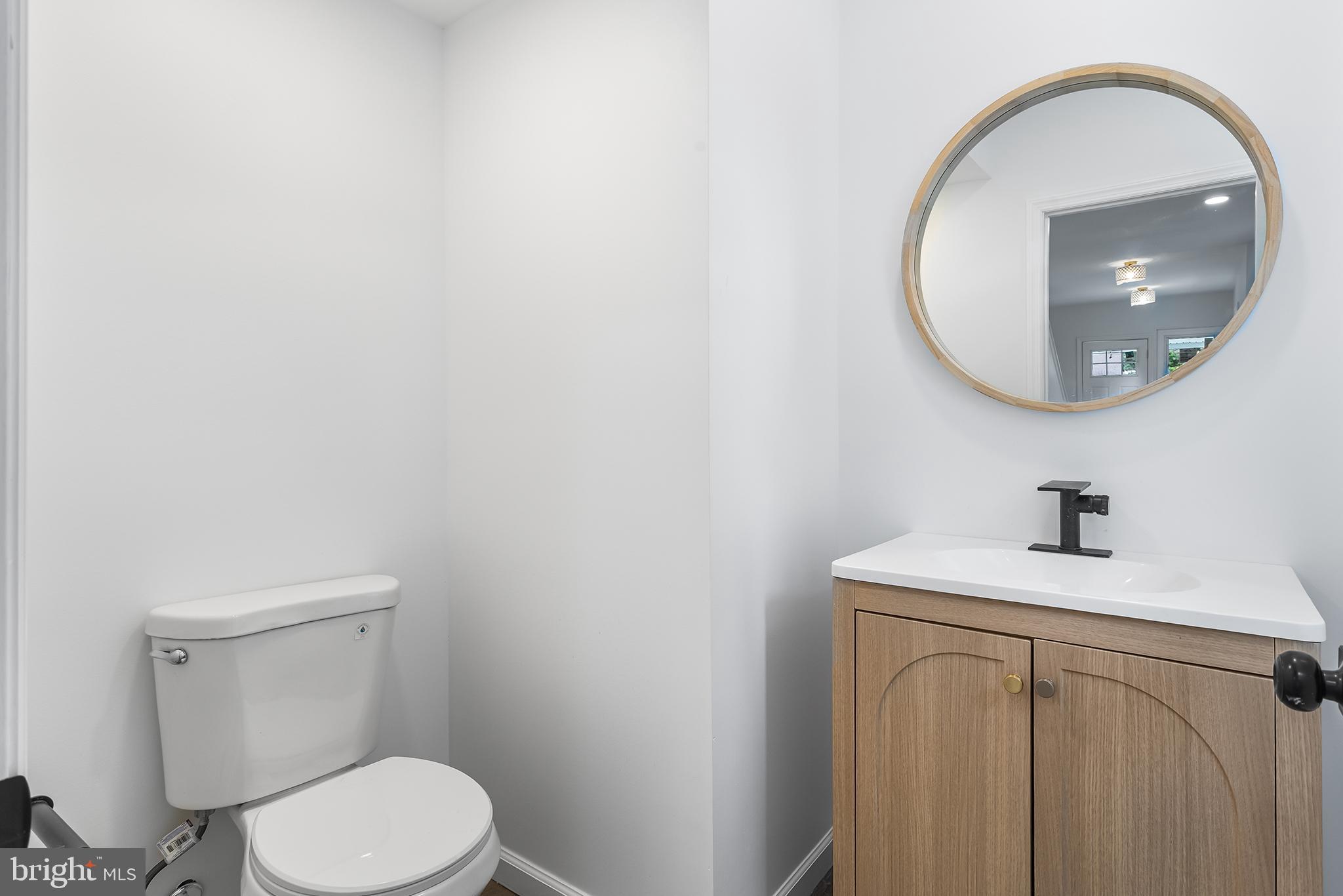 97 Erial Road Clementon, NJ 08021 - Photo 16 of 48 a bathroom with a toilet a sink and mirror
