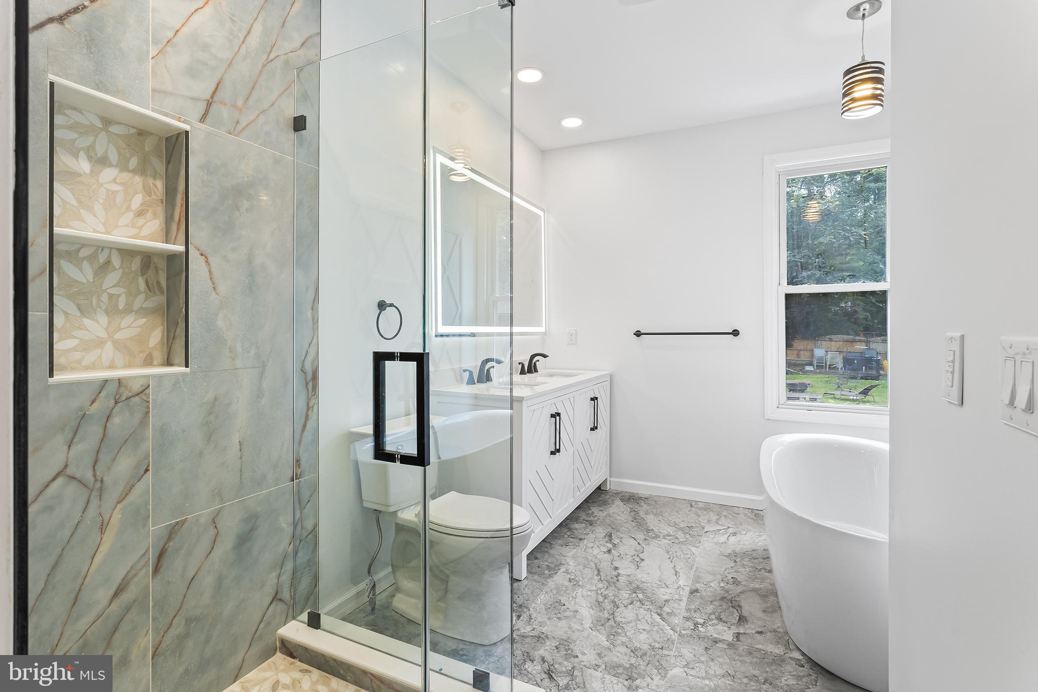 97 Erial Road Clementon, NJ 08021 - Photo 19 of 48 a bathroom with a granite countertop sink a toilet a mirror and shower