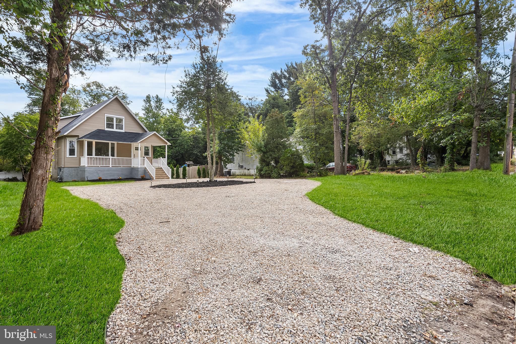 97 Erial Road Clementon, NJ 08021 - Photo 2 of 48 a front view of a house with a yard and trees
