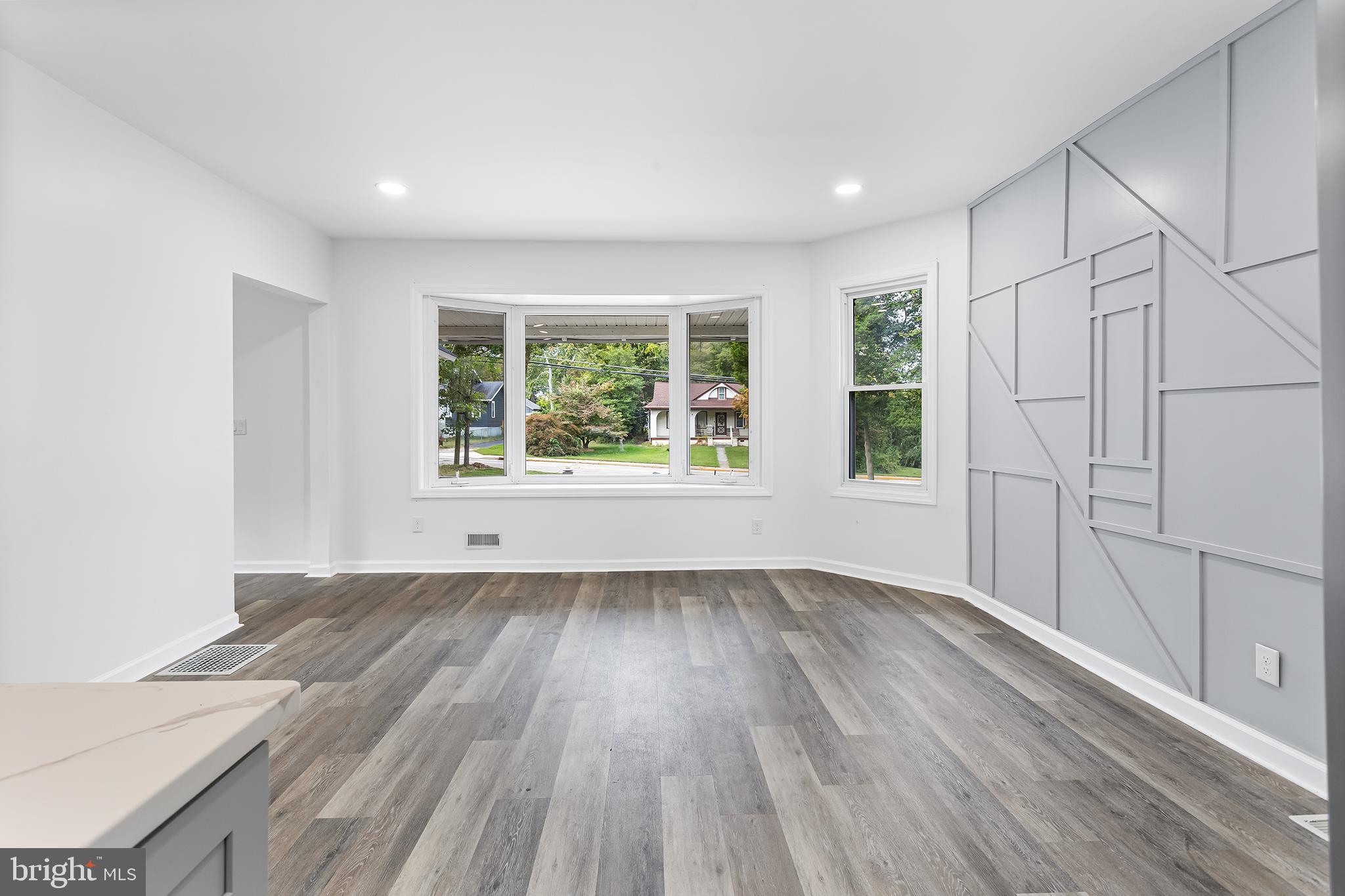 97 Erial Road Clementon, NJ 08021 - Photo 10 of 48 an empty room with wooden floor and windows