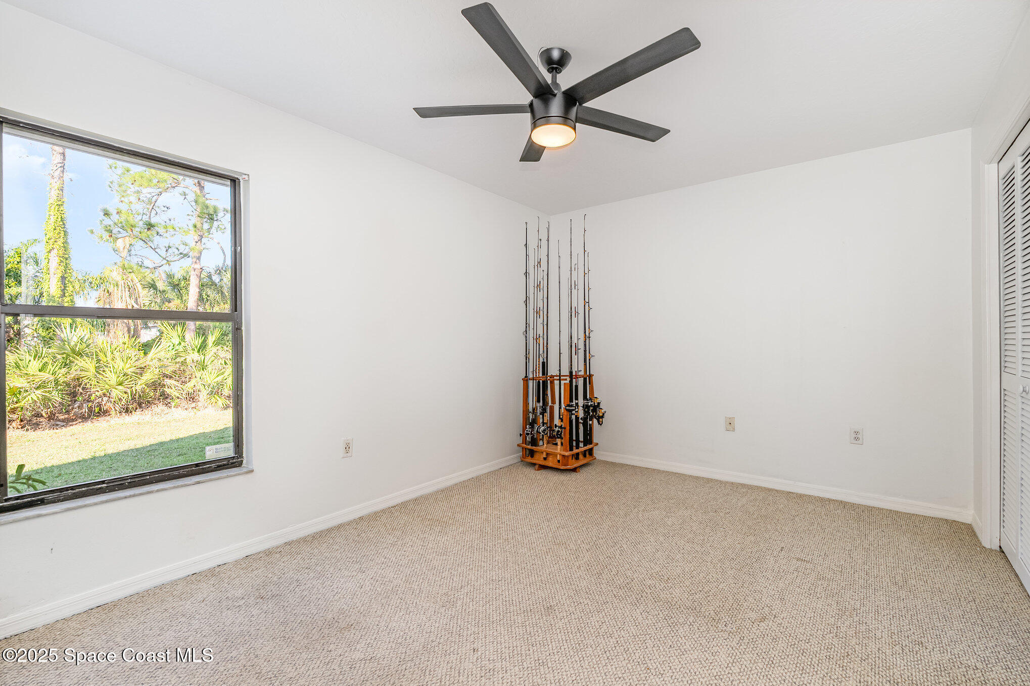 5720 Flint Road Cocoa, FL 32927 - Photo 14 of 26 an empty room with a window