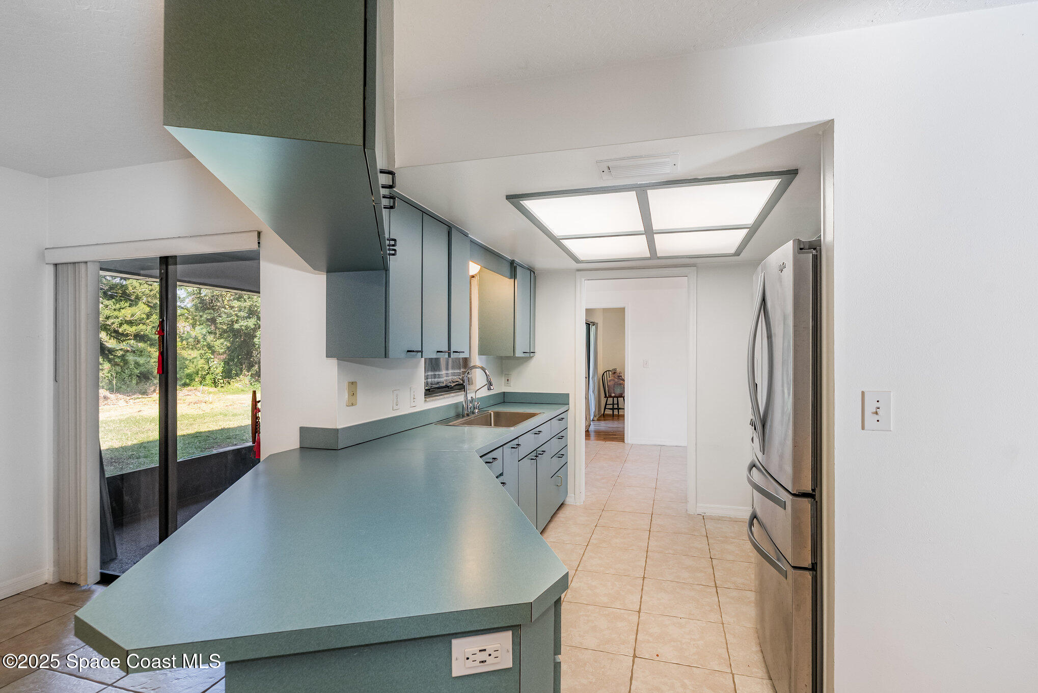 5720 Flint Road Cocoa, FL 32927 - Photo 20 of 26 a large kitchen with a sink and cabinets