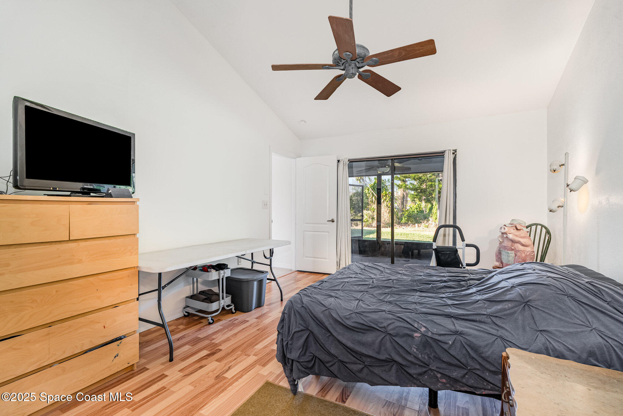 5720 Flint Road Cocoa, FL 32927 - Photo 6 of 26 a bedroom with a bed and a flat screen tv