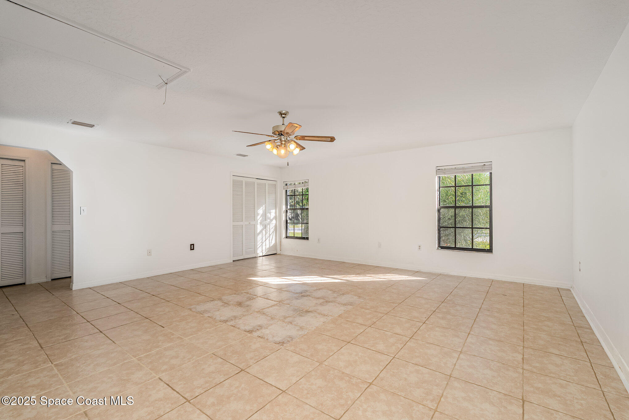 5720 Flint Road Cocoa, FL 32927 - Photo 9 of 26 a view of an empty room with a window