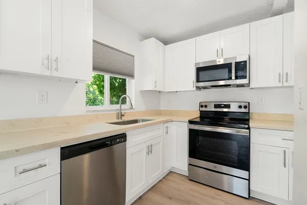 view of a room with bed and wooden floor